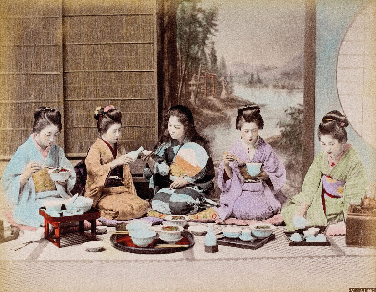 A group of Japanese women eating a meal. 