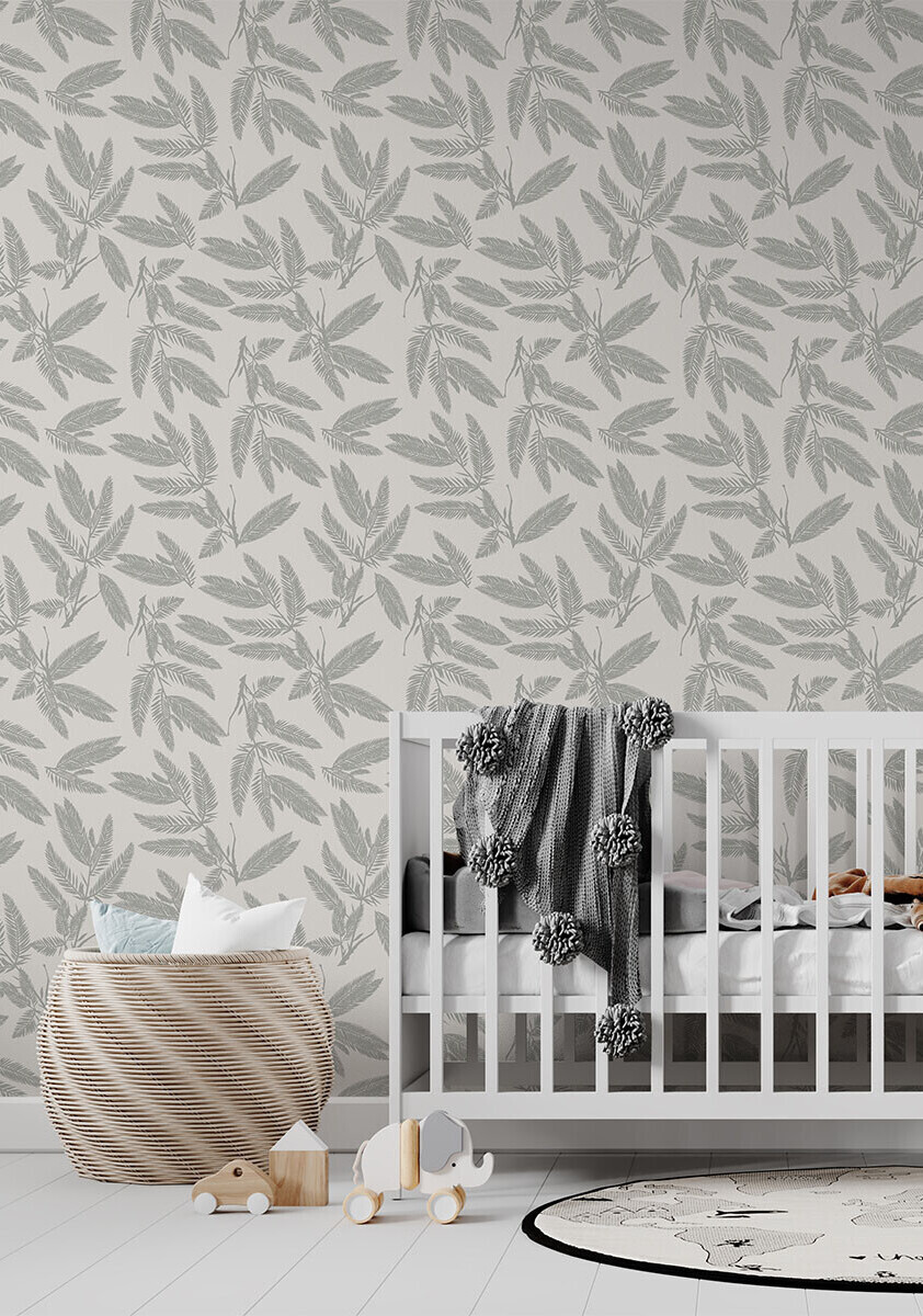 A repeated silhouette pattern of pale silver fern leaves on a cream background.