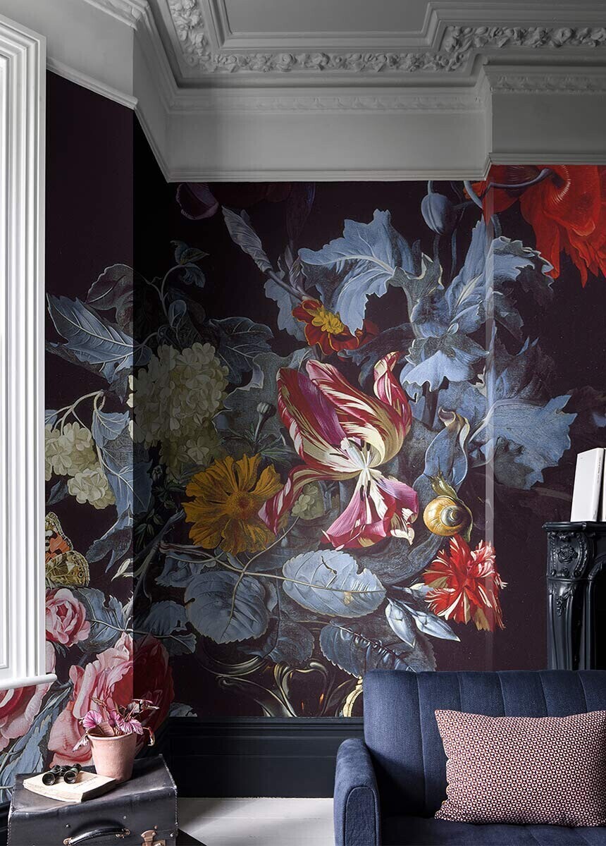 dark floral wall mural in the living room with blue sofa